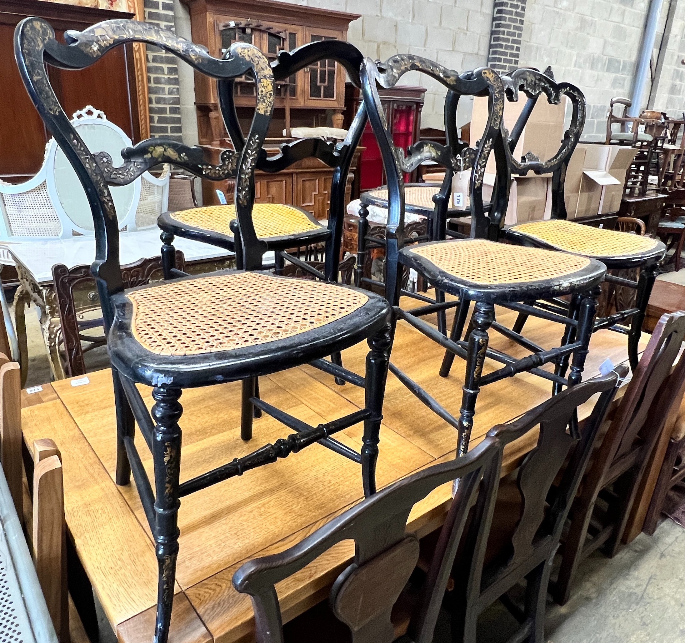 Five Victorian mother of pearl inlaid papier mache cane seat chairs